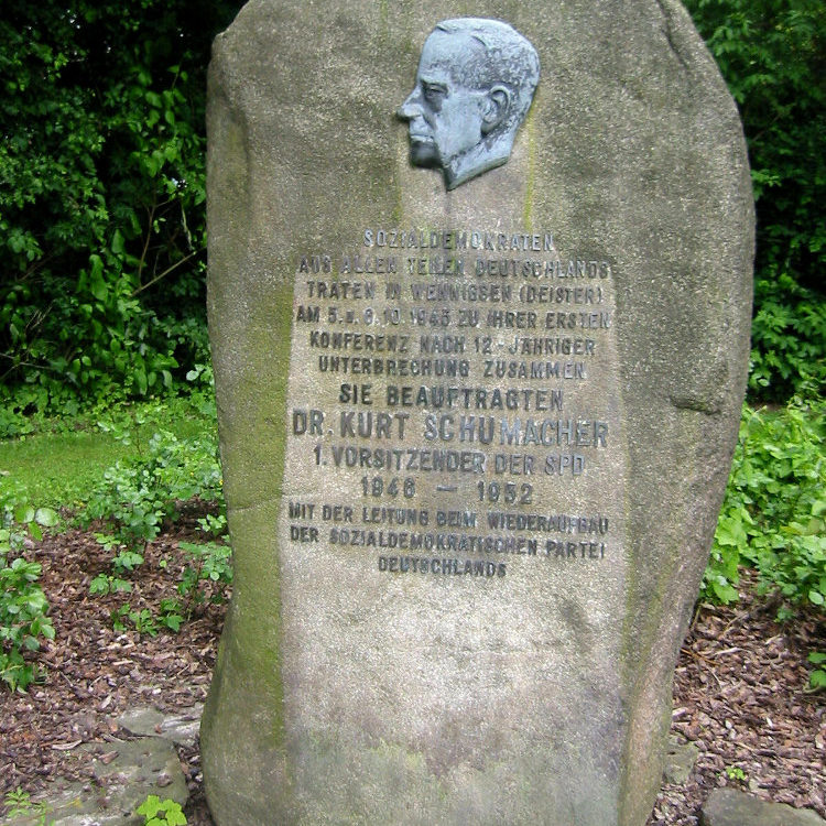 Memorial to Kurt Schumacher erected in 1967 opposite Wennigsen railway station, 2006. Inscription: ON 5-8 OCTOBER 1945, SOCIAL DEMOCRATS FROM ALL OVER GERMANY MET IN WENNIGSEN (DEISTER) FOR THEIR FIRST CONFERENCE AFTER A 12-YEAR DISRUPTION. THEY APPOINTED DR. KURT SCHUMACHER 1ST CHAIRMAN OF THE SPD 1946 - 1952 TO LEAD THE RECONSTRUCTION OF THE SOCIAL DEMOCRATIC PARTY OF GERMANY. Wikimedia Commons